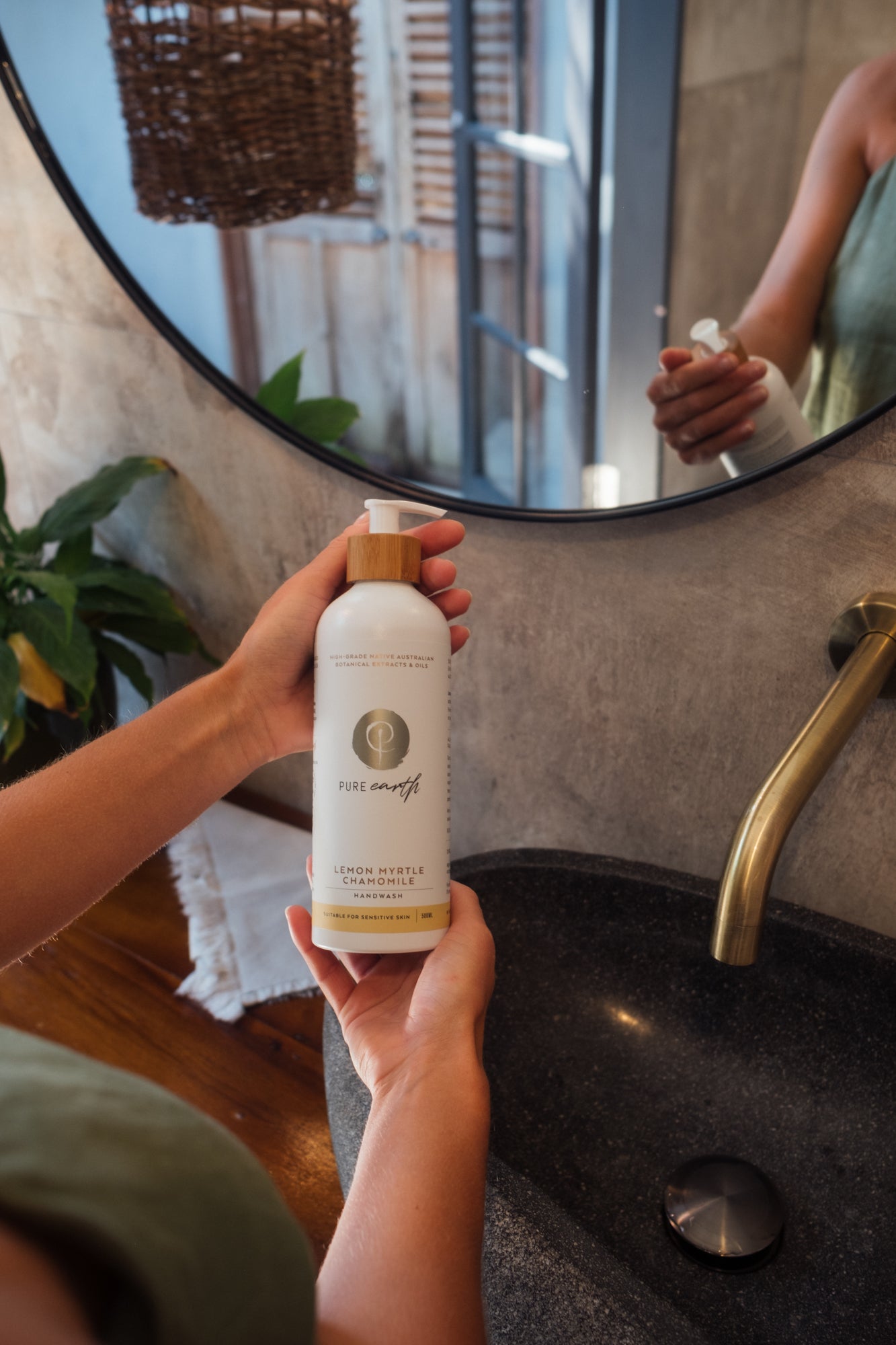 A pump bottle of natural hand wash with &