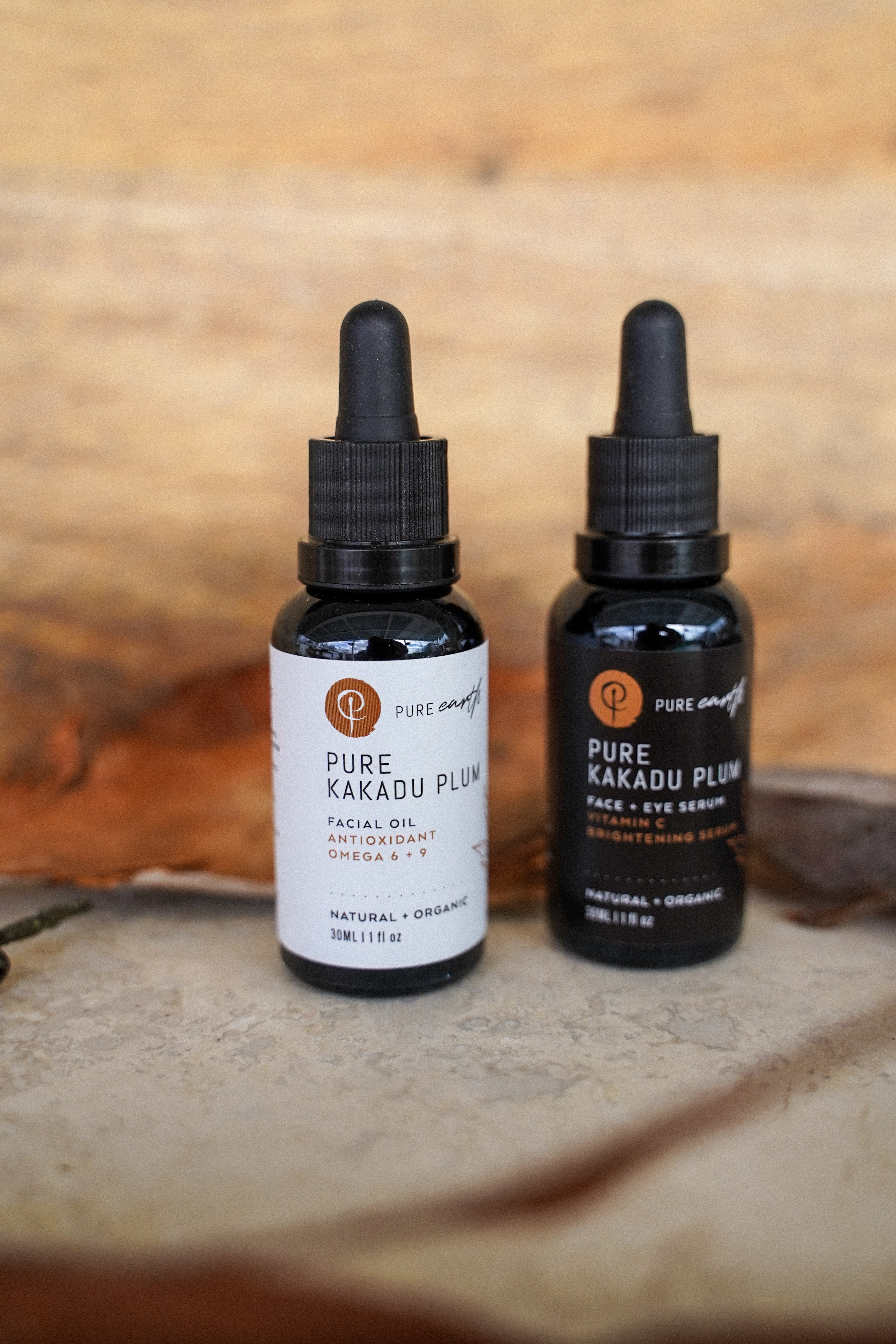 Two black dropper bottles labeled &