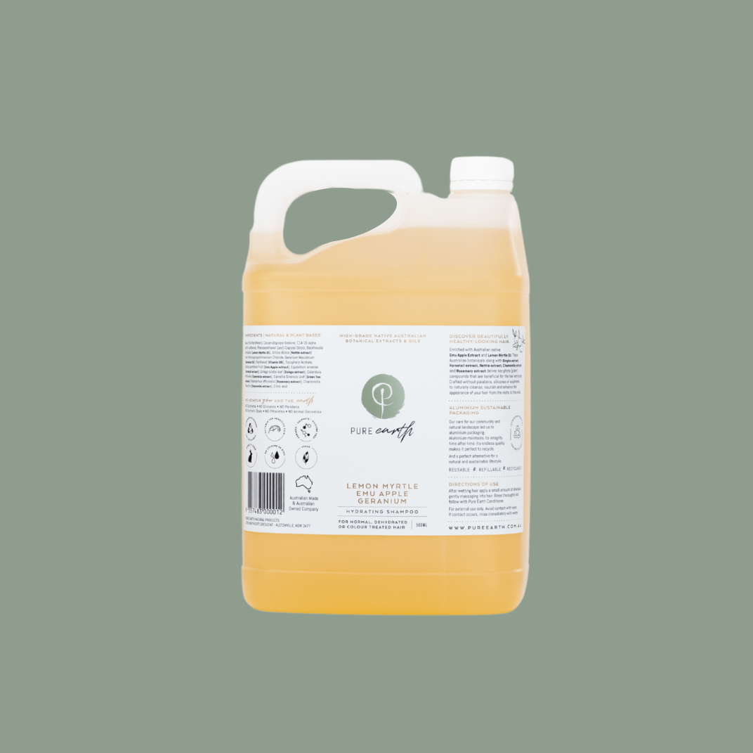 A bulk-sized yellow shampoo bottle with a white label.