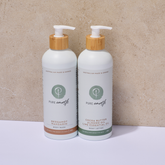 Two bottles of Pure Earth body wash and lotion on a beige background