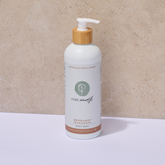 Bottle of Pure Earth body wash with bergamot and pump on a neutral background