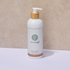Bottle of Pure Earth body wash with bergamot and pump on a neutral background