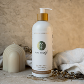 A pump bottle of natural body wash with the label &