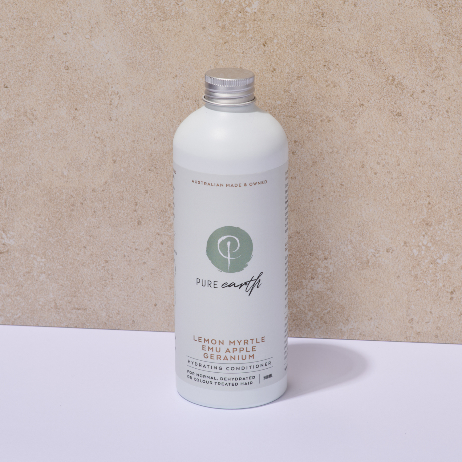 White bottle of Pure Earth hydrating conditioner on a beige background with natural  bamboo pump