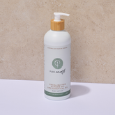 White bottle of pure earth natural body lotion with pump and wooden pump on a beige background