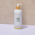 Bottle of Pure Earth lemon myrtle chamomile handwash with a wooden pump on a beige background