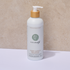 White Pure Earth Hydrating Conditioner bottle with a wooden pump on a beige background