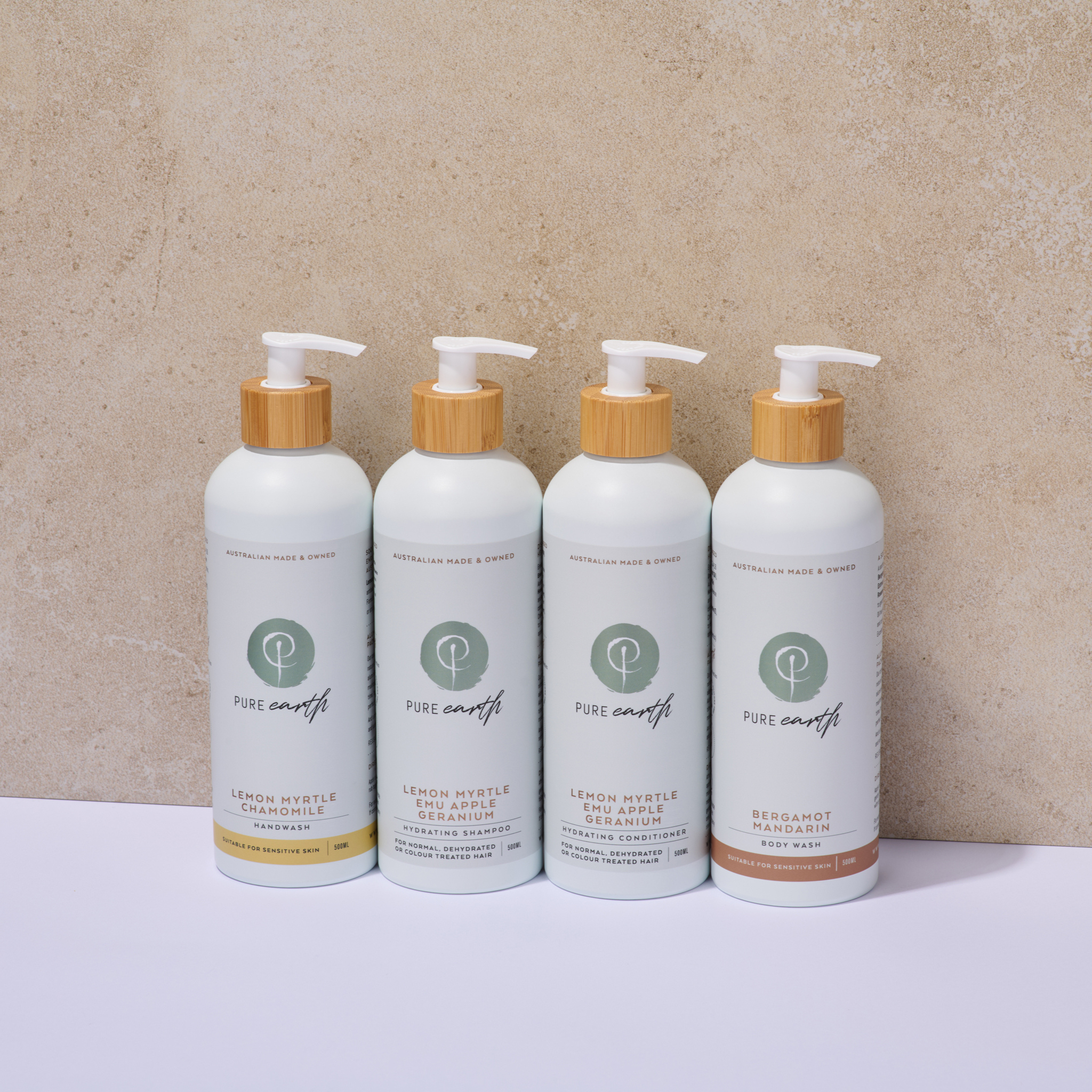 Four bottles of Pure Earth products on a beige background