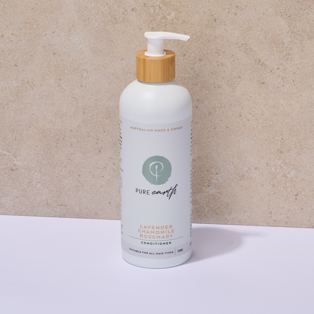 White Pure Earth bottle with pump and wooden cap on a beige background