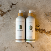 Image of Pure Earth Natural Body Lotion with Lime Essential and Body Wash with Bergamot on a textured background 
